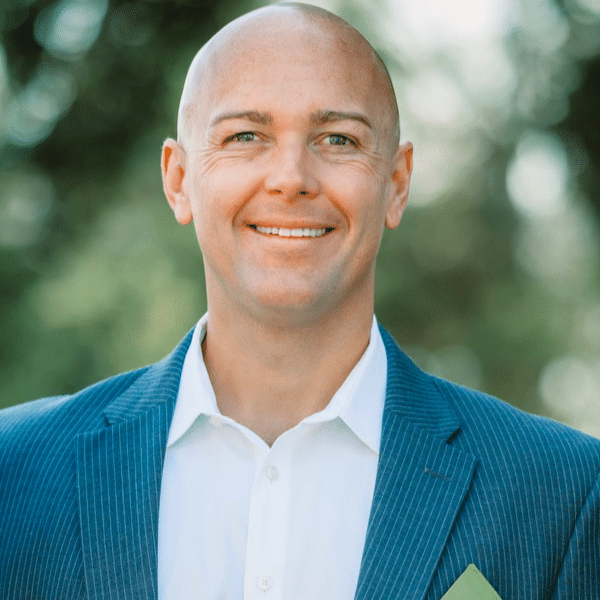 Dr. Brent Sexton smiling outdoors in a blue blazer at Delta Smiles in Antioch and Brentwood, CA