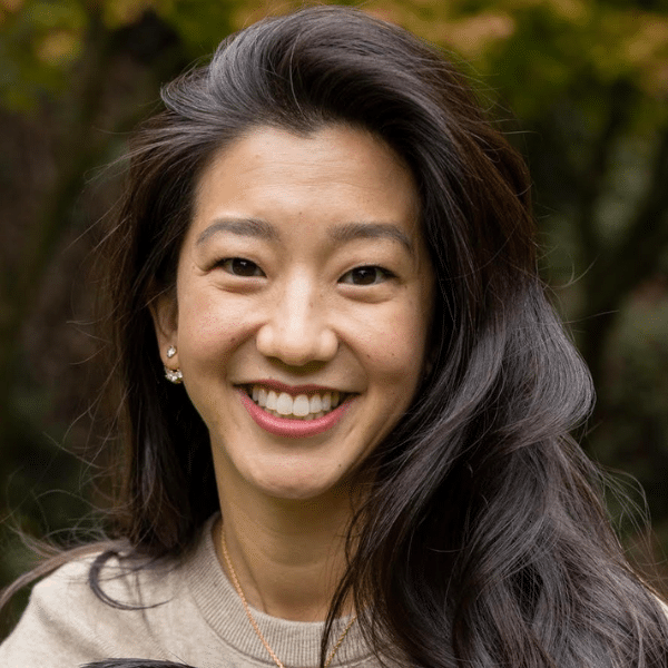 Dr. Tiffany Louie smiling outdoors with long dark hair at Delta Smiles in Antioch and Brentwood, CA